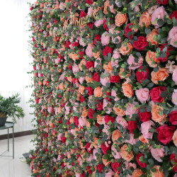 red pink orange roses and green leaves cloth roll up flower wall fabric hanging curtain plant wall event party wedding backdrop